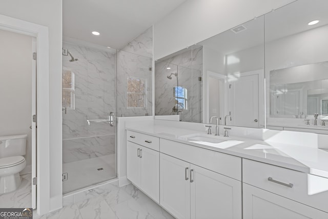 bathroom with vanity, toilet, and a shower with door