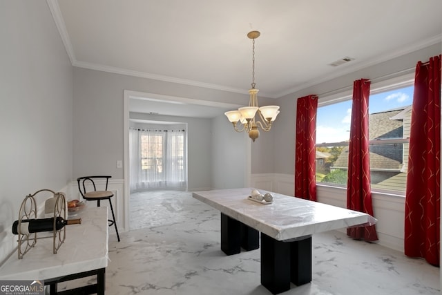 dining space featuring a notable chandelier, plenty of natural light, and crown molding