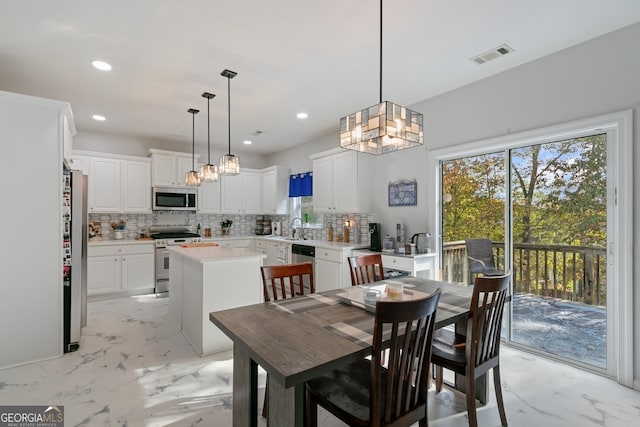 dining space with sink