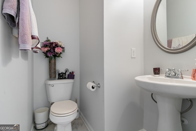 bathroom with toilet and sink