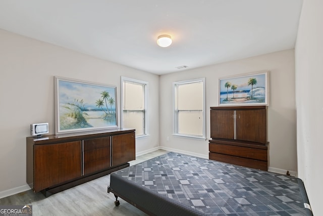 bedroom with wood-type flooring