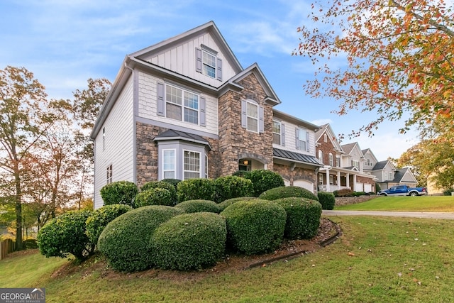 view of front of house with a garage and a front yard