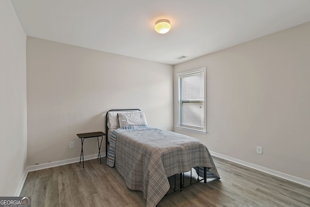 bedroom featuring hardwood / wood-style floors