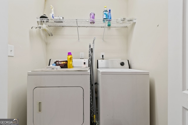 clothes washing area with independent washer and dryer