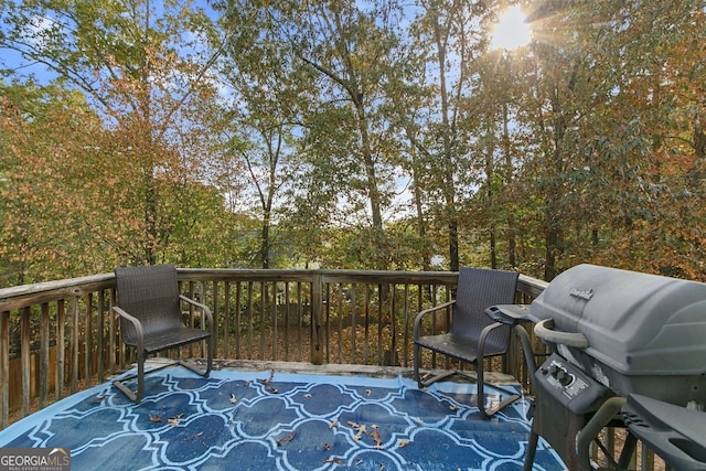 wooden terrace featuring grilling area