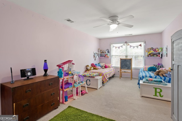 bedroom featuring ceiling fan and light colored carpet