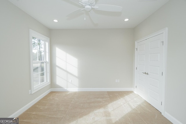 carpeted empty room with ceiling fan