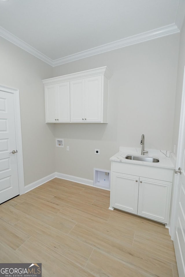 laundry area featuring electric dryer hookup, crown molding, sink, washer hookup, and light hardwood / wood-style floors