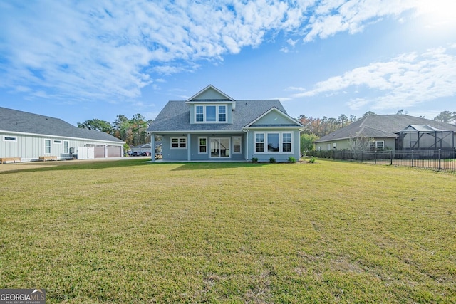 rear view of house with a yard