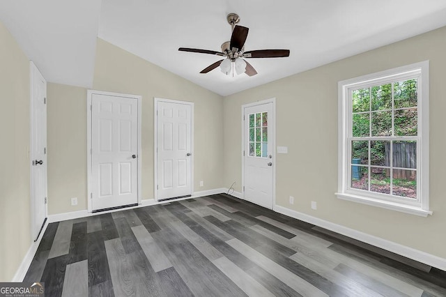 entryway featuring a ceiling fan, baseboards, dark wood-style floors, and plenty of natural light