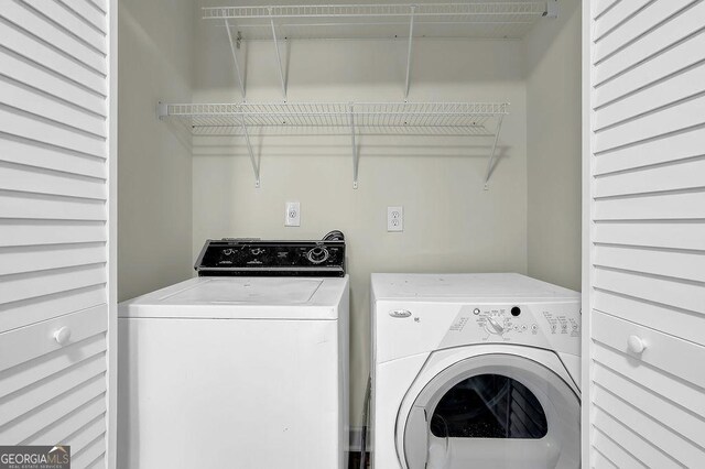 clothes washing area with laundry area and separate washer and dryer