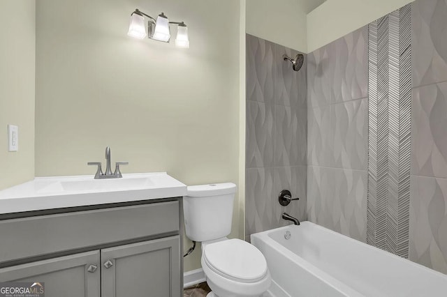 bathroom featuring toilet, vanity, and bathing tub / shower combination