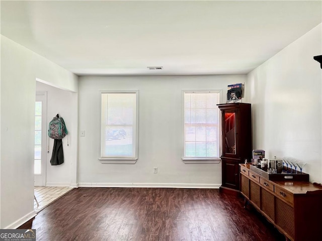 interior space with dark hardwood / wood-style flooring