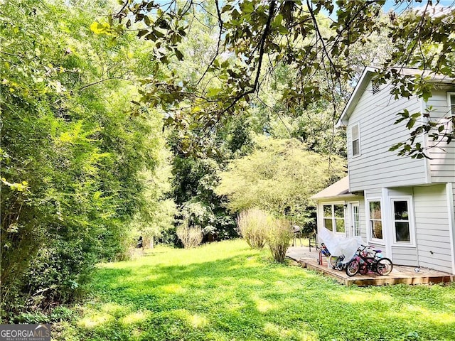 view of yard with a deck