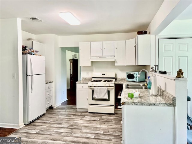 kitchen featuring white cabinets, light hardwood / wood-style floors, white appliances, and sink