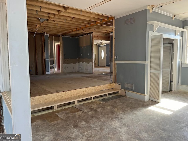 interior space with crown molding