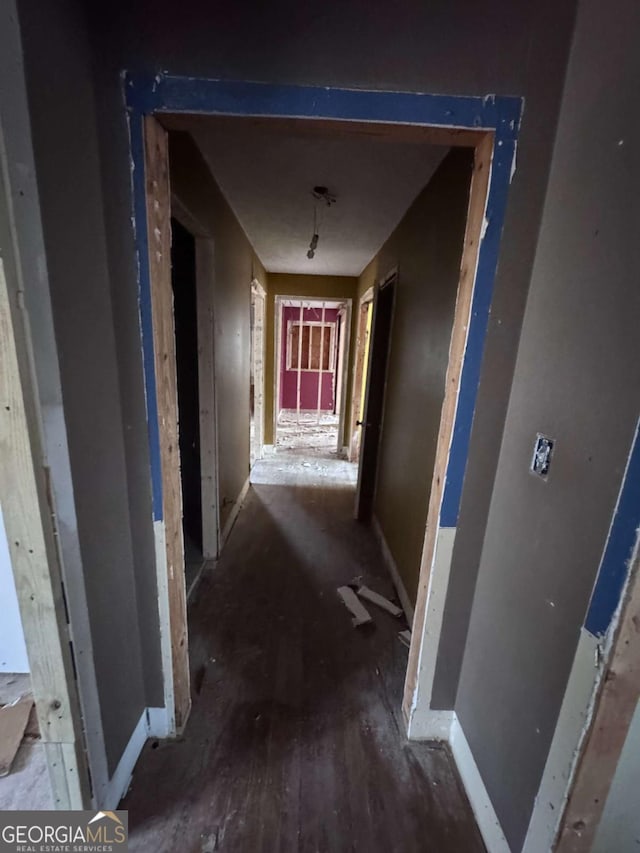 corridor with hardwood / wood-style floors