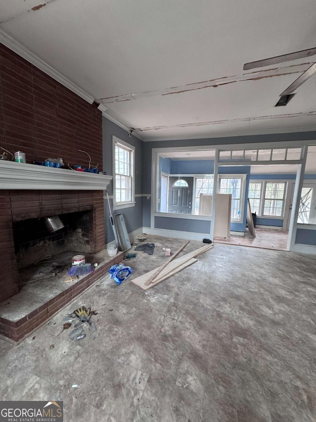 unfurnished living room with a fireplace and ornamental molding