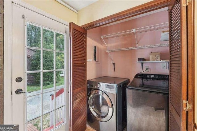 washroom featuring washing machine and dryer