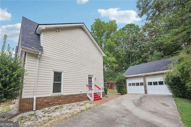 view of home's exterior featuring a garage and an outdoor structure