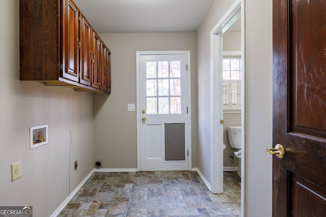 clothes washing area featuring hookup for an electric dryer, cabinets, and hookup for a washing machine