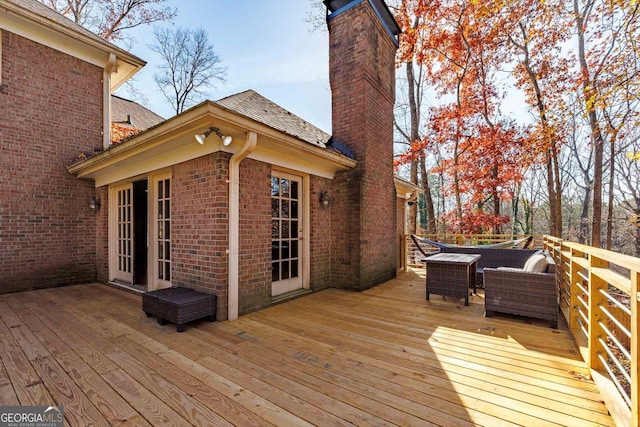 wooden deck featuring an outdoor hangout area