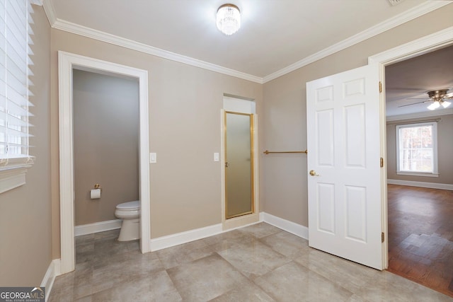 bathroom with hardwood / wood-style flooring, toilet, ceiling fan, and ornamental molding