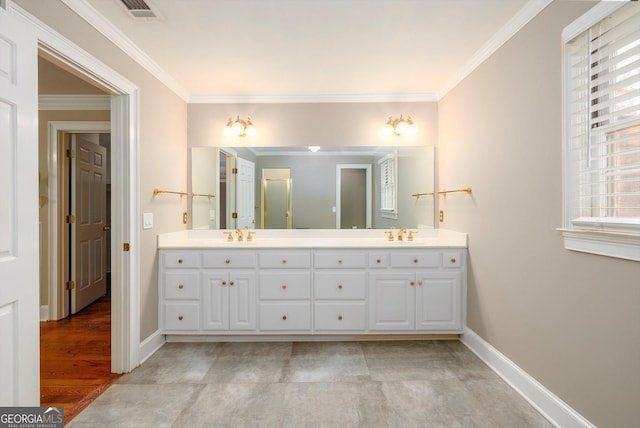 bathroom with hardwood / wood-style flooring, vanity, and crown molding