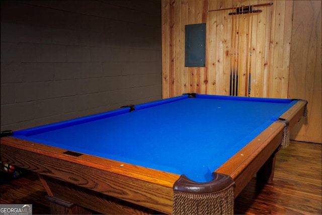 playroom featuring electric panel, wooden walls, dark hardwood / wood-style floors, and pool table