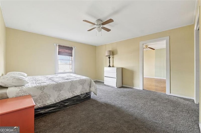 bedroom with ceiling fan and carpet floors