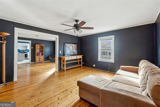 living room with ceiling fan and wood-type flooring