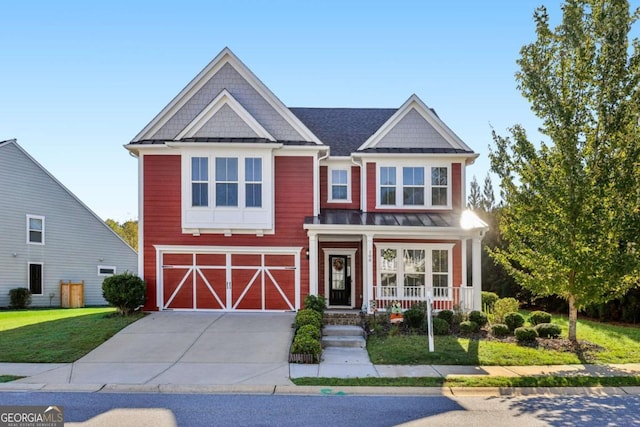 view of front of home featuring a garage and a front yard