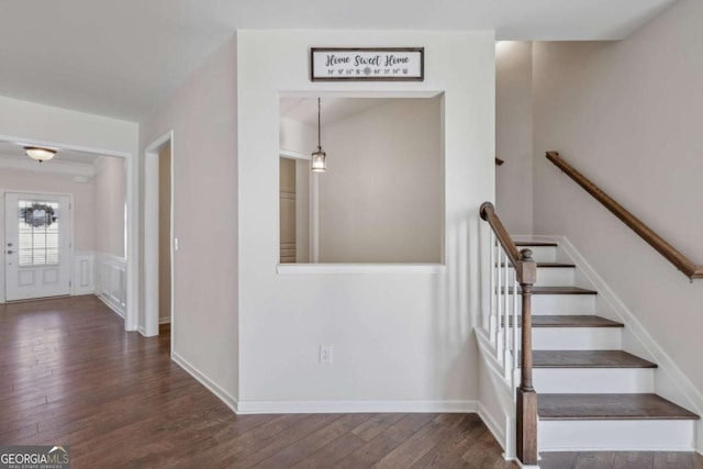 stairs with wood-type flooring