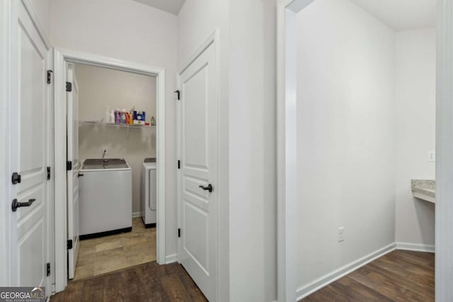 washroom featuring independent washer and dryer and dark wood-type flooring