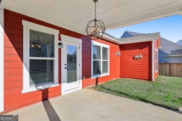 entrance to property featuring a yard