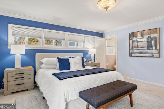 bedroom with crown molding, light carpet, and connected bathroom