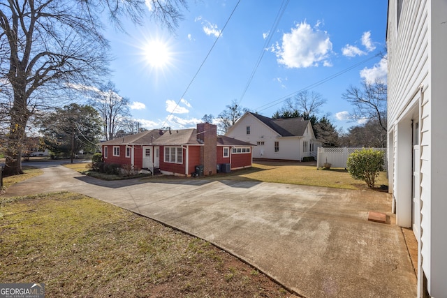 view of property exterior featuring a yard