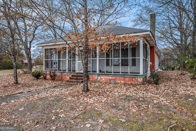 view of front of property with a sunroom