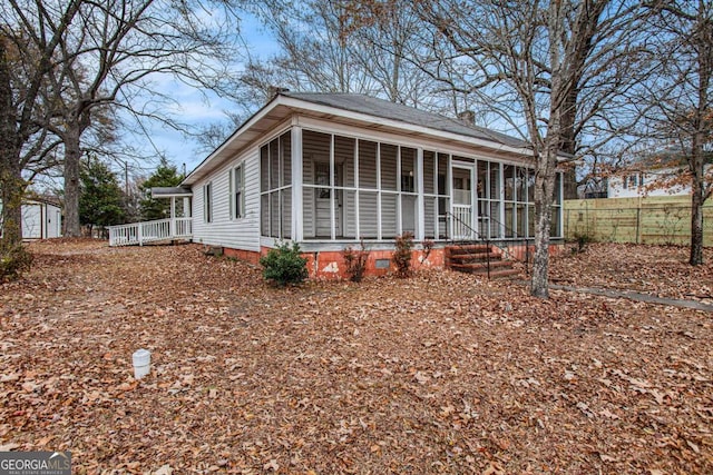 view of front of home with a sunroom