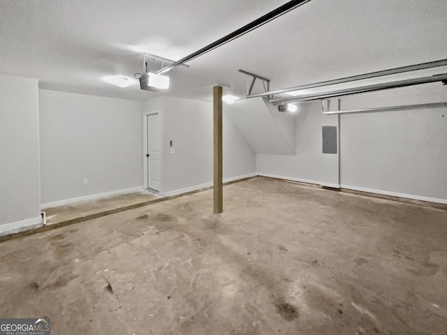 garage featuring electric panel and a garage door opener