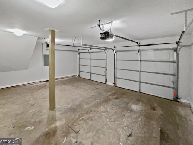 garage with electric panel and a garage door opener