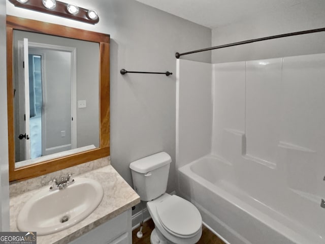 full bathroom featuring shower / bathing tub combination, vanity, and toilet