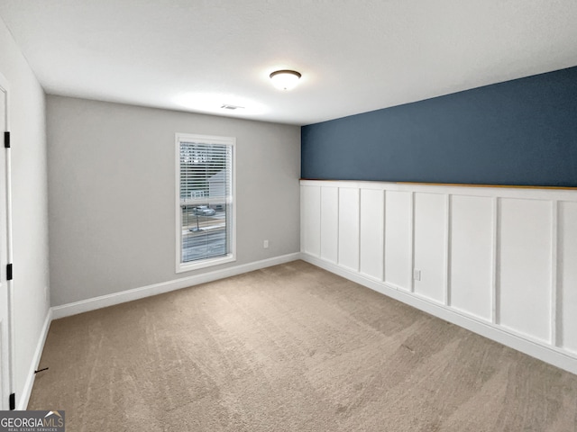 view of carpeted spare room