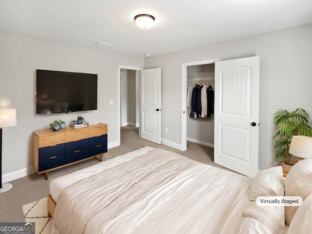 bedroom featuring light colored carpet and a closet