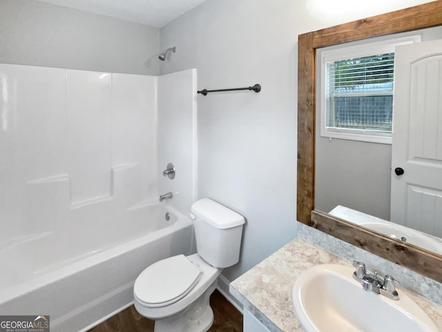 full bathroom with vanity,  shower combination, toilet, and wood-type flooring