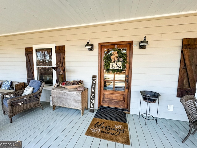 doorway to property featuring a porch