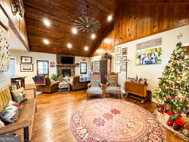 living room featuring wood ceiling, ceiling fan, wood-type flooring, and high vaulted ceiling