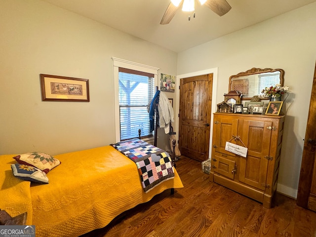 bedroom featuring dark hardwood / wood-style floors and ceiling fan