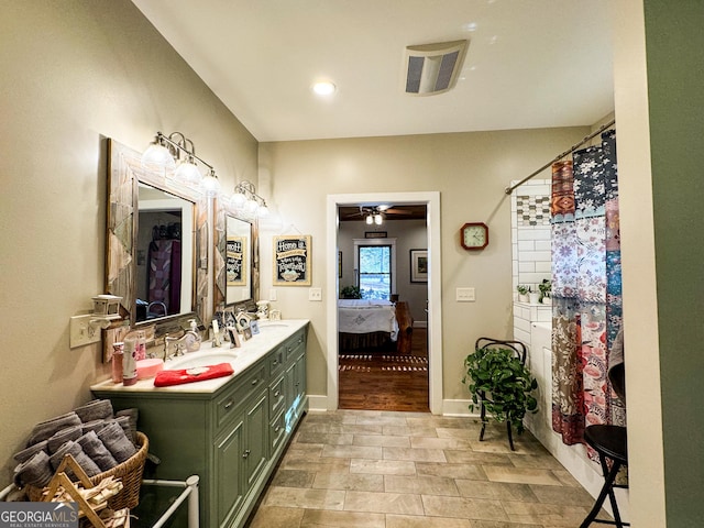 bathroom with curtained shower, ceiling fan, vanity, and hardwood / wood-style flooring