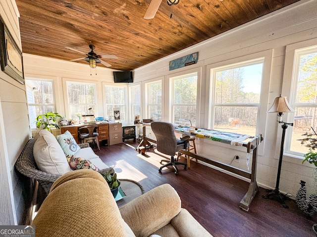 sunroom / solarium with ceiling fan, a healthy amount of sunlight, and wood ceiling